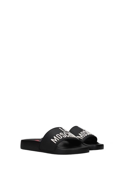 Shop Love Moschino Slippers And Clogs Rubber Black
