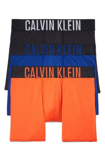 Shop Calvin Klein 3-pack Boxer Briefs In Black/ Orange/ Blue