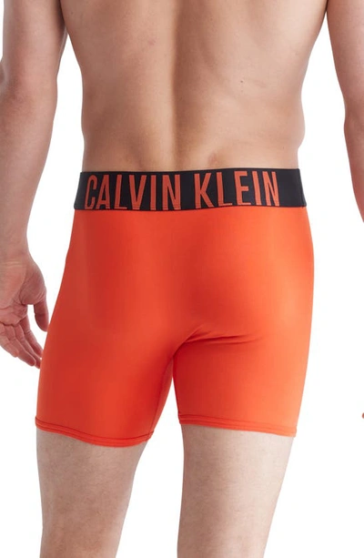 Shop Calvin Klein 3-pack Boxer Briefs In Black/ Orange/ Blue