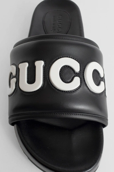 Shop Gucci Man Black Slides
