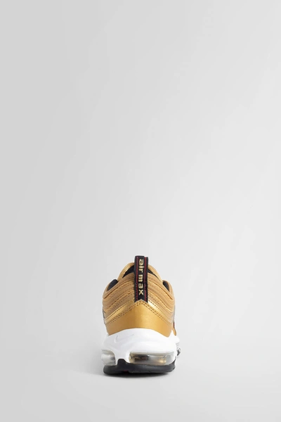 Shop Nike Man Gold Sneakers