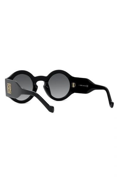 Shop Loewe Chunky Anagram 49mm Small Round Sunglasses In Shiny Black / Gradient Smoke