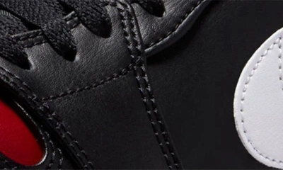 Shop Jordan Air  1 Low Sneaker In Black/ Gym Red/ White
