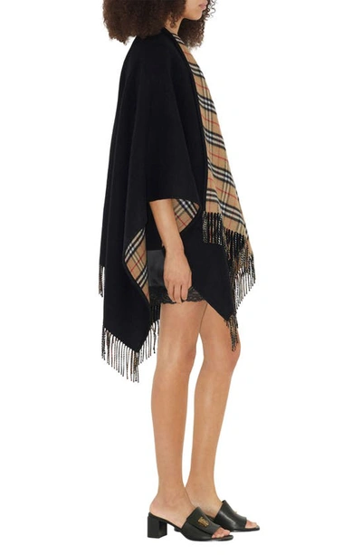 Shop Burberry Check Reversible Wool Cape In Black