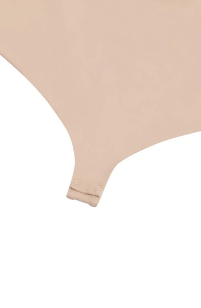 Shop Wolford Mat De Luxe Shaping Thong Bodysuit In Powder