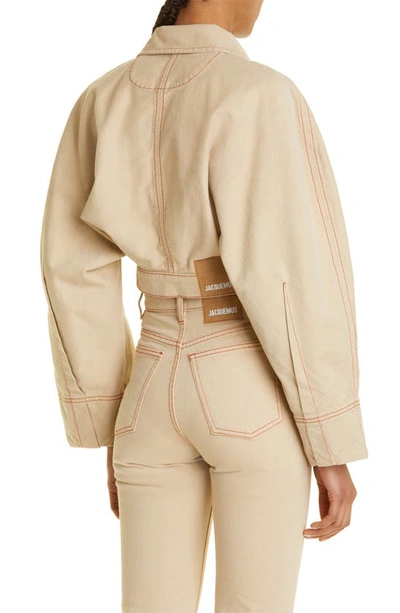 Shop Jacquemus Nimes Meio Organic Cotton Denim Crop Jacket In 15b Beige/ Terracotta