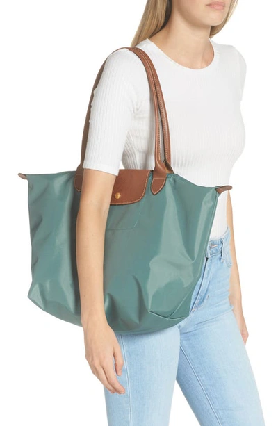 Shop Longchamp Large Le Pliage Tote In Cypress