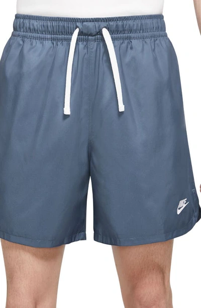 Shop Nike Woven Lined Flow Shorts In Diffused Blue/ White