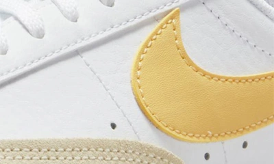 Shop Nike Kids' Blazer Low '77 Low Top Sneaker In White/ Sail/ Orange/ Gold