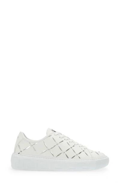 Shop Versace La Greca Cutout Stud Low Top Sneaker In White