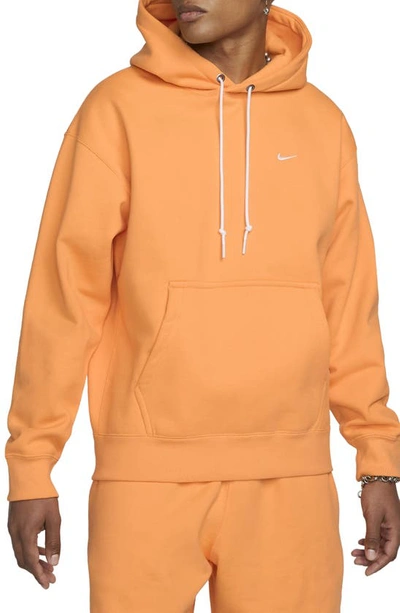 Shop Nike Solo Swoosh Fleece Hoodie In Vivid Orange/ White