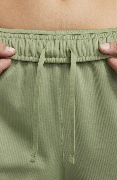 Shop Nike Dri-fit Tempo Ribbed Running Shorts In Oil Green/ Oil Green