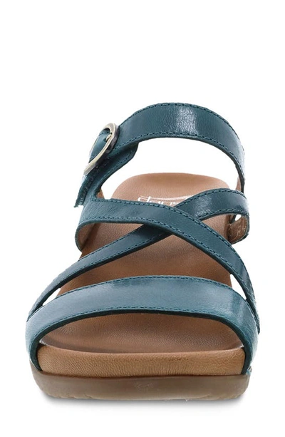 Shop Dansko Ana Asymmetric Strappy Wedge Sandal In Teal Glazed Calf