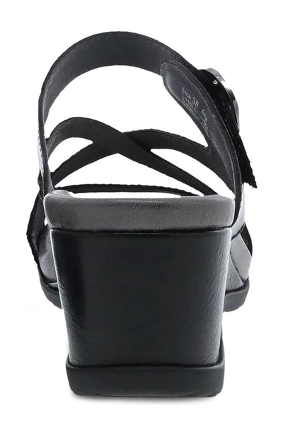 Shop Dansko Ana Asymmetric Strappy Wedge Sandal In Black Glazed Calf