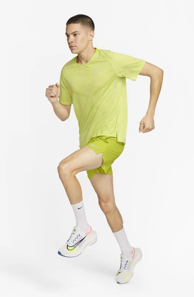 Shop Nike Dri-fit Stride 5-inch Running Shorts In Bright Cactus/moss