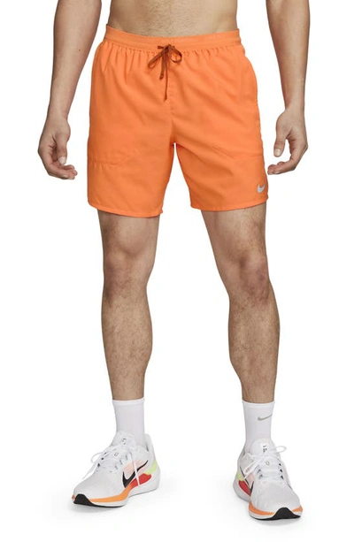 Shop Nike Dri-fit Stride 7-inch Brief-lined Running Shorts In Bright Mandarin/dark Russet