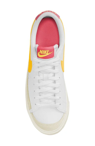 Shop Nike Kids' Blazer Low '77 Low Top Sneaker In White/ Gold/ Sail/ Orange