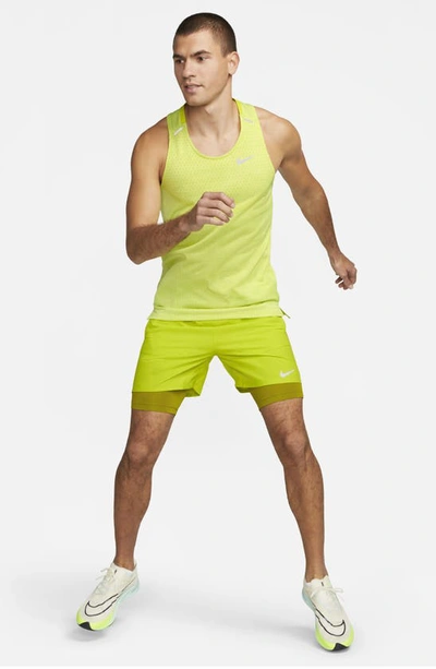 Shop Nike Dri-fit Adv Techknit Ultra Running Tank In Bright Cactus/lt Lemon Twist