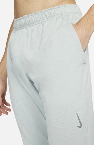 Shop Nike Pocket Yoga Pants In Light Silver/ Mica Green