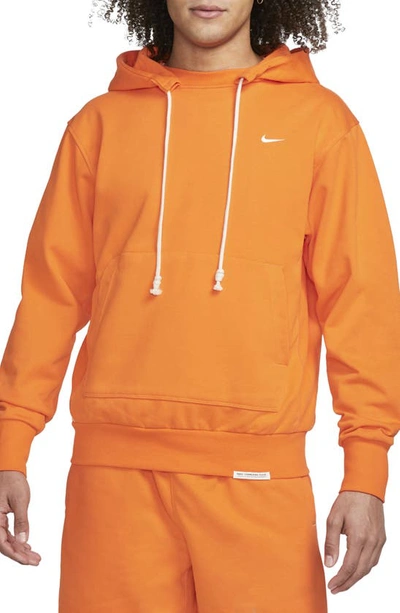 Shop Nike Dri-fit Standard Issue Hoodie Sweatshirt In Safety Orange/ Pale Ivory