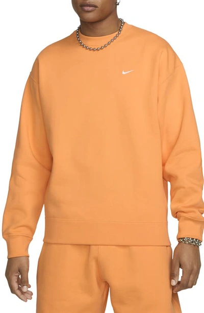 Shop Nike Solo Swoosh Oversize Crewneck Sweatshirt In Vivid Orange/ White