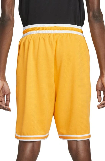 Shop Nike Dri-fit Dna Mesh Shorts In University Gold/ White