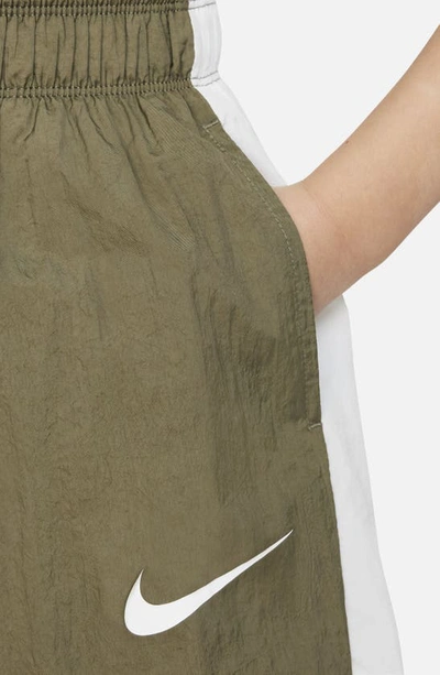 Shop Nike Kids' Sportswear Side Stripe Track Pants In Medium Olive/ White/ White