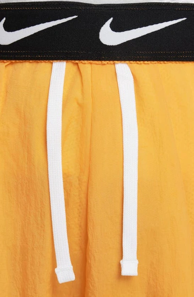 Shop Nike Kids' Sportswear Side Stripe Track Pants In Vivid Orange/ White/ White