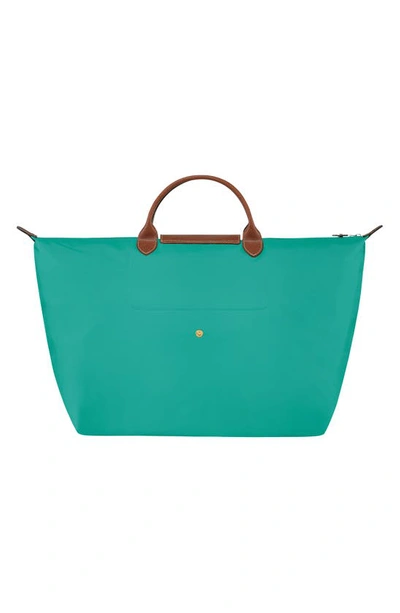 Shop Longchamp Large Le Pliage Travel Bag In Turquoise