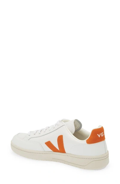 Shop Veja V-12 Low Top Sneaker In Extra-white Pumpkin