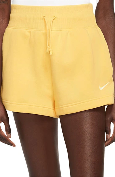 Shop Nike Phoenix Fleece Knit Shorts In Topaz Gold/ Sail