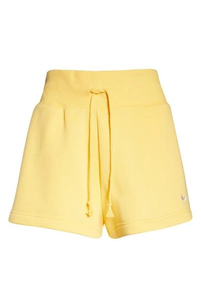 Shop Nike Phoenix Fleece Knit Shorts In Topaz Gold/ Sail