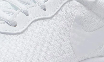 Shop Nike Tanjun Running Shoe In White/ White-white-volt
