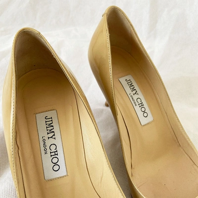 Pre-owned Jimmy Choo Beige Patent Leather Round Toe Pumps, 37.5 In Used / 37.5 / Beige