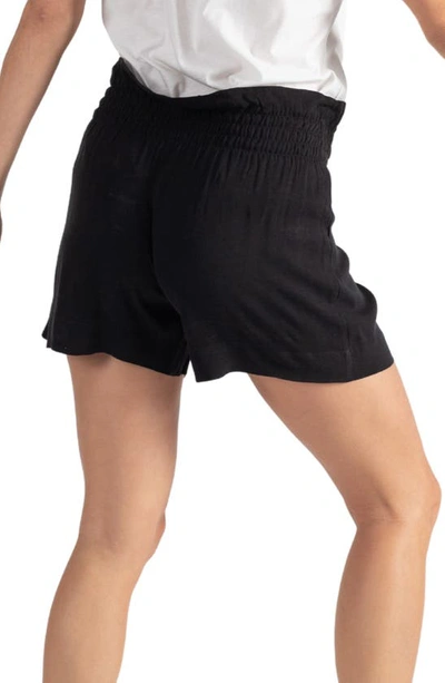 Shop Cache Coeur Nubie Smocked Twill Maternity Shorts In Black