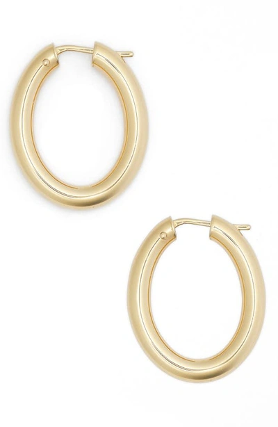 Shop Roberto Coin Oval Hoop Earrings In Yellow