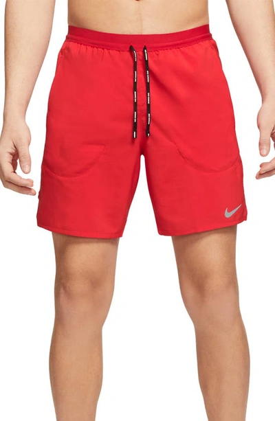 Shop Nike Flex Stride Performance Athletic Shorts In University Red/ University Red