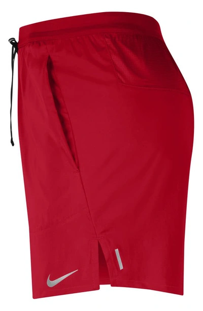 Shop Nike Flex Stride Performance Athletic Shorts In University Red/ University Red