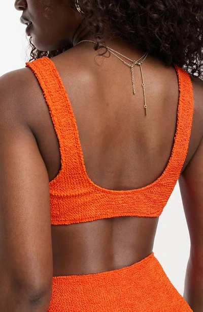 Shop Asos Design Crinkle Scoop Bikini Top In Orange
