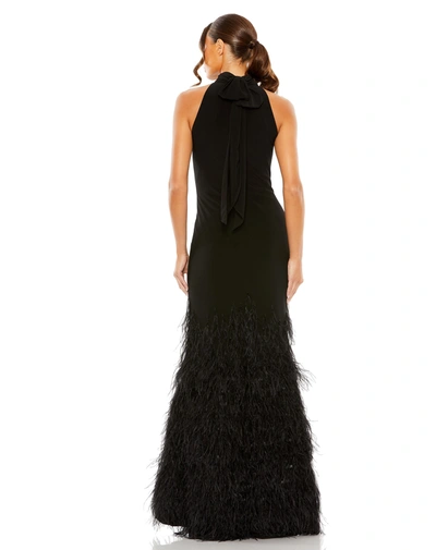 Shop Mac Duggal Jersey Halter Gown With Feather Tiered Detail In Black