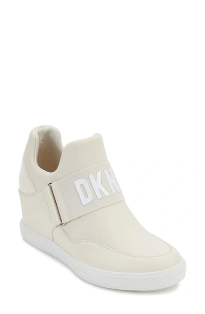 Shop Dkny Cosmos Wedge Sneaker In Egg Nog