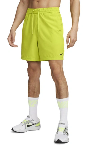 Shop Nike Dri-fit Form Athletic Shorts In Bright Cactus/ Black