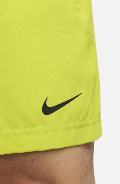 Shop Nike Dri-fit Form Athletic Shorts In Bright Cactus/ Black