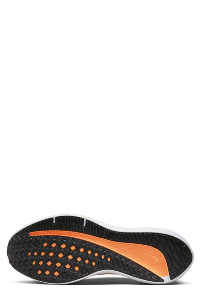 Shop Nike Air Winflo 10 Running Shoe In White/ Volt/ Orange