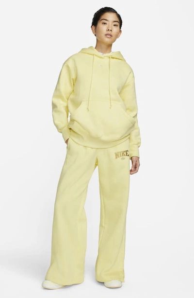 Shop Nike Sportswear Phoenix Oversize Fleece Hoodie In Lemon Chiffon/ Sail
