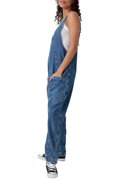 Free People High Roller Denim Jumpsuit In Sapphire Blue