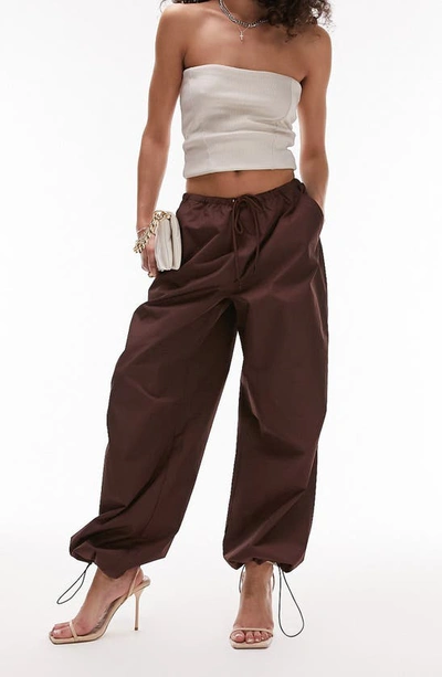 Shop Topshop Oversize Parachute Trousers In Brown