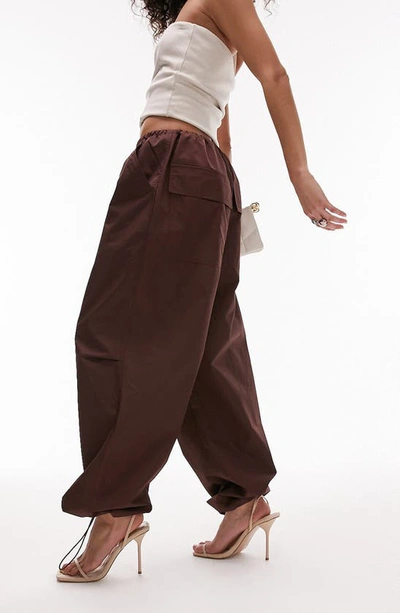 Shop Topshop Oversize Parachute Trousers In Brown