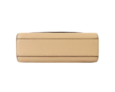 Shop Michael Kors Ellis Flap Messenger In Beige