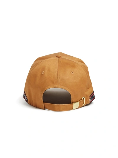 Shop Guess Factory Logo Tape Canvas Baseball Hat In Brown